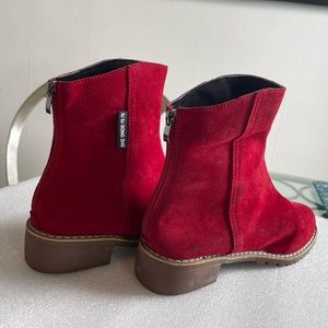 Red vegan suede ankle boots.